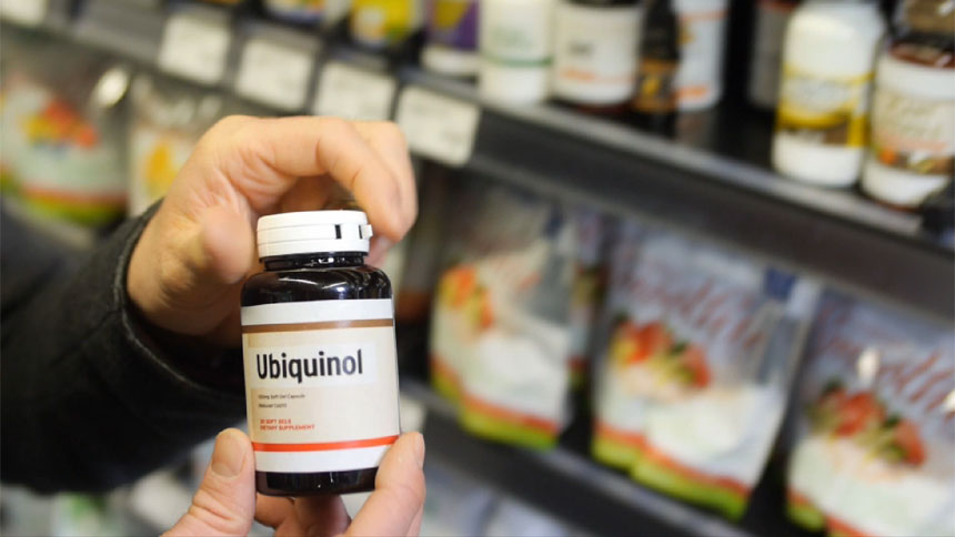 holding bottle of Ubiquinol