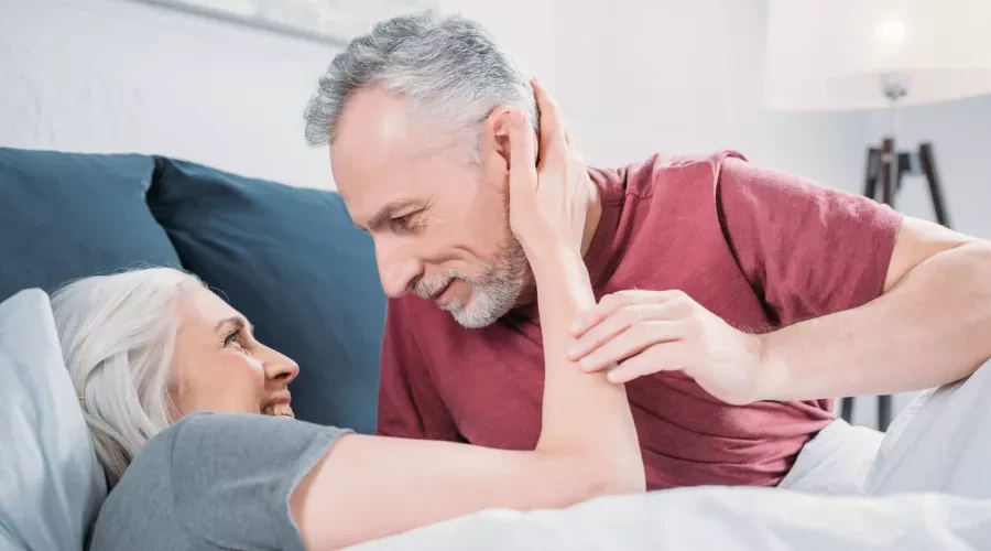 Senior Couple in bed, snuggling