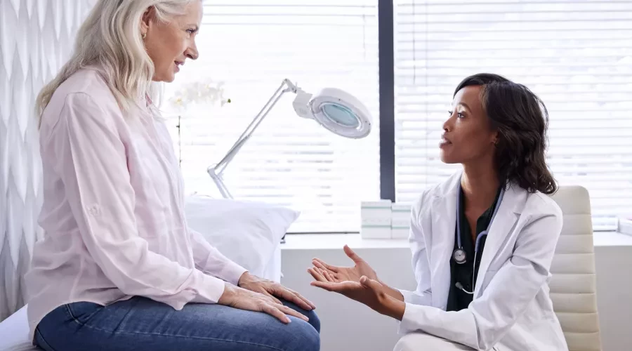 Older patience consulting with doctor