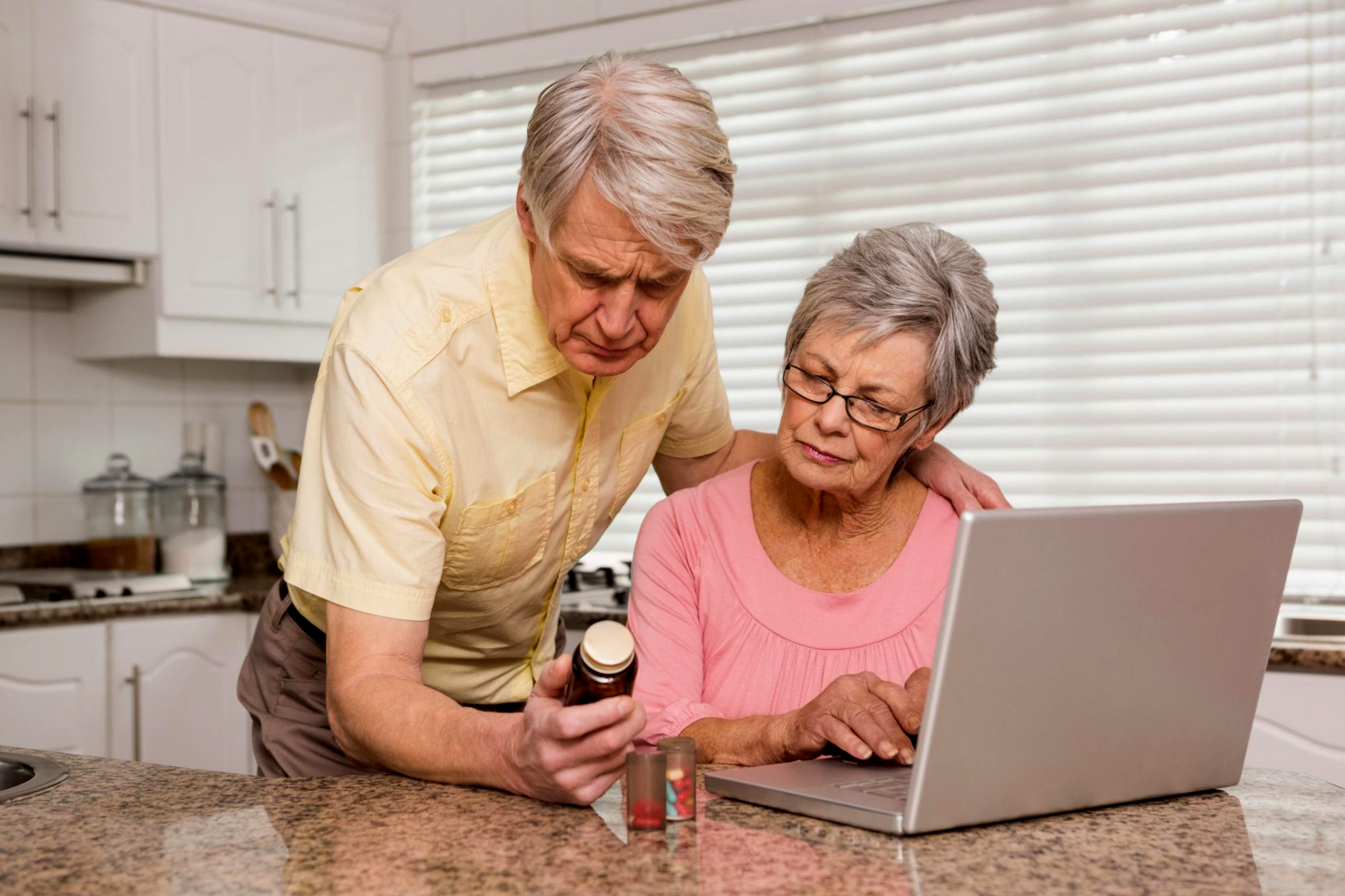husband and wife researching supplements
